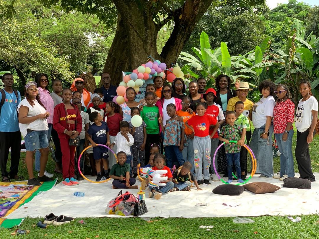 Children reading outdoors in nature